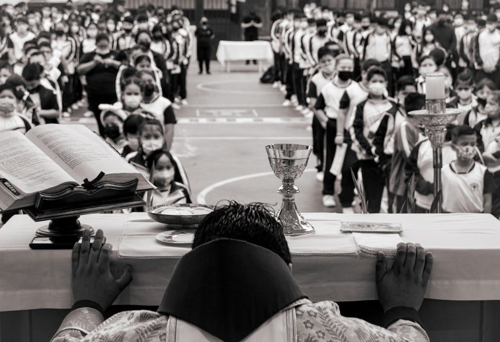 Children Standing on School Ground Attending Mass